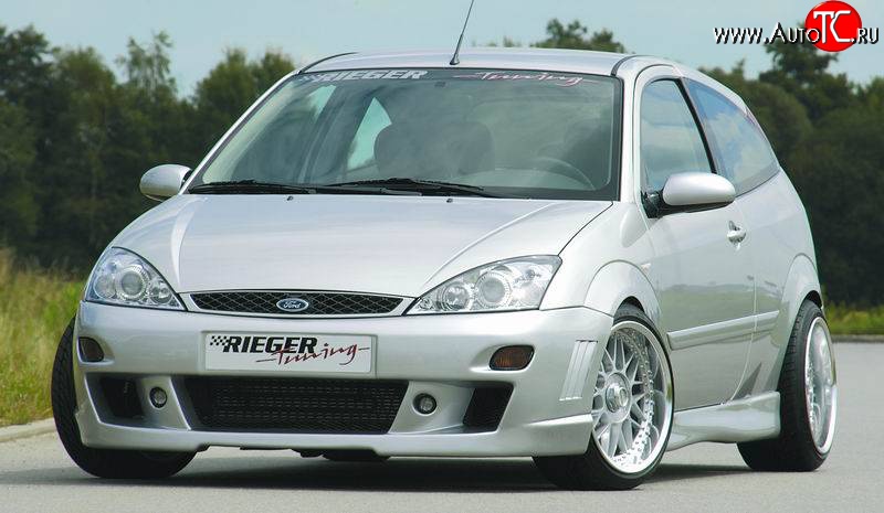 8 899 р. Передний бампер Rieger  Ford Focus  1 (1998-2005) седан дорестайлинг, универсал дорестайлинг, хэтчбэк 3 дв. дорестайлинг, хэтчбэк 5 дв. дорестайлинг, седан рестайлинг, универсал рестайлинг, хэтчбэк 3 дв. рестайлинг, хэтчбэк 5 дв. рестайлинг  с доставкой в г. Нижний Новгород