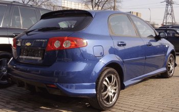 4 099 р. Накладка заднего бампера ATL  Chevrolet Lacetti  хэтчбек (2002-2013) (Неокрашенная)  с доставкой в г. Нижний Новгород. Увеличить фотографию 1